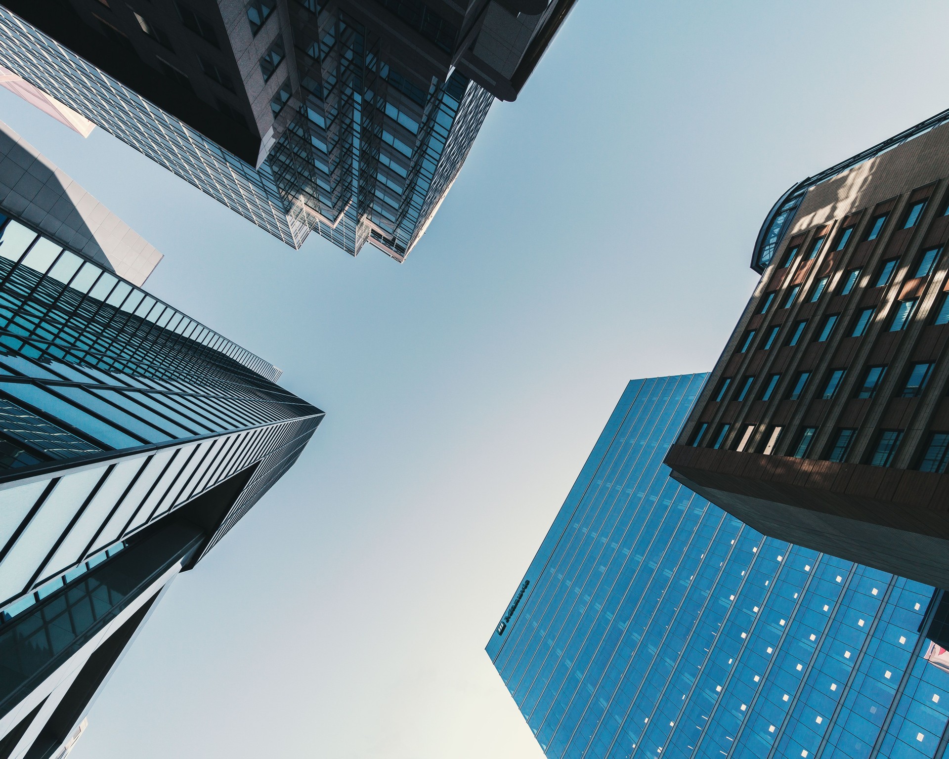 Low Angle View Of Modern Buildings Against Clear Blue Sky